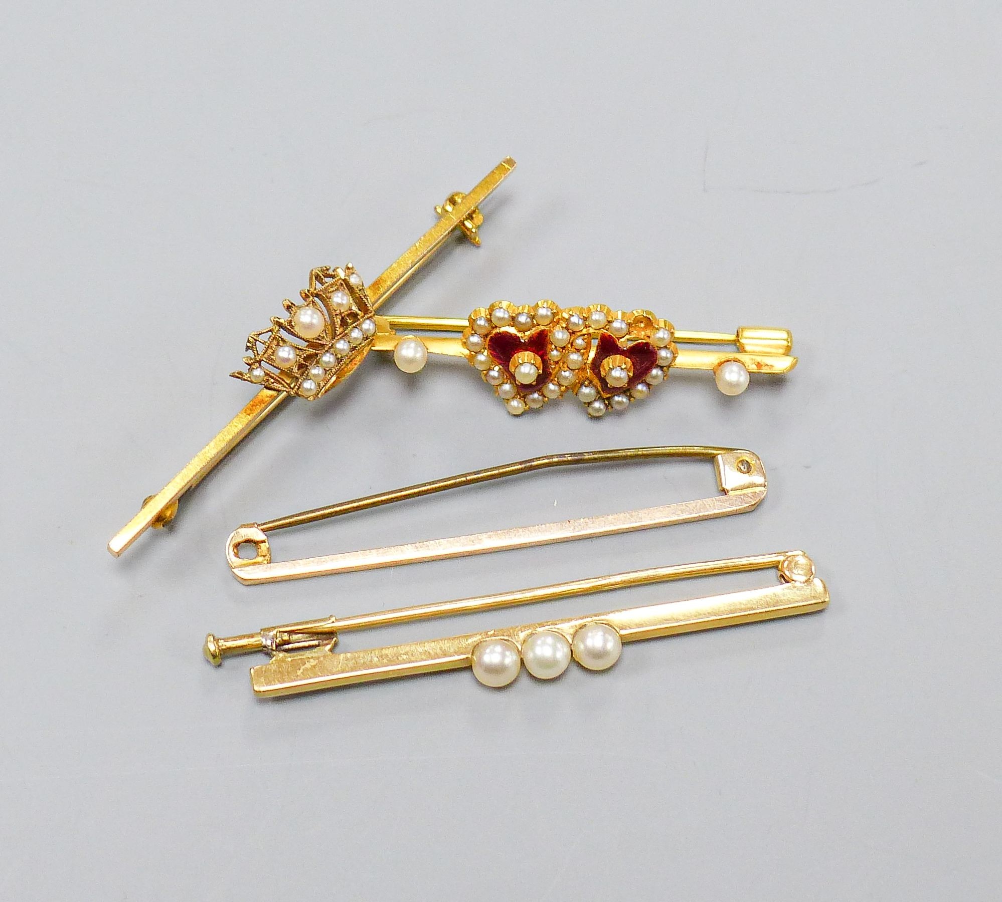 Four 9ct gold bar brooches, three set with seed pearls, largest 47mm, gross 10.4 grams.